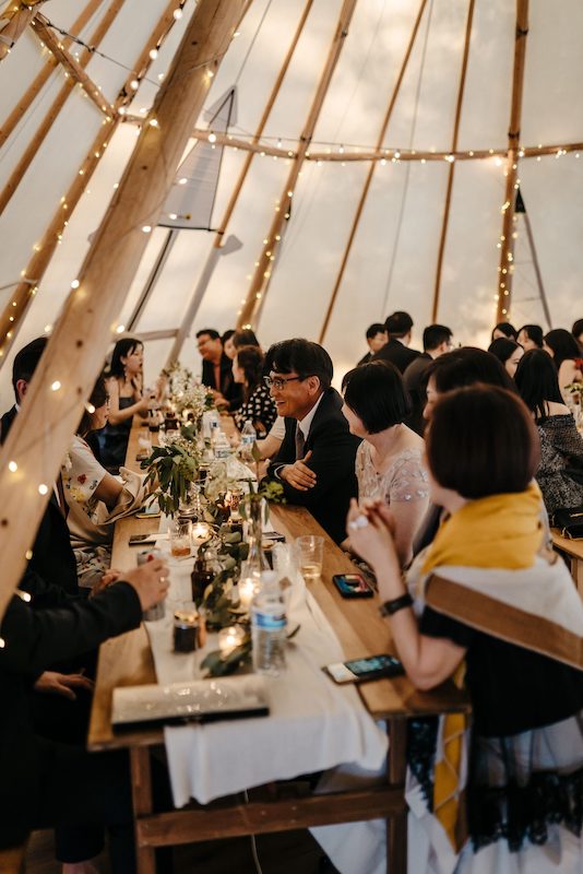 A group of people sitting at a table in a Houston wedding venue.